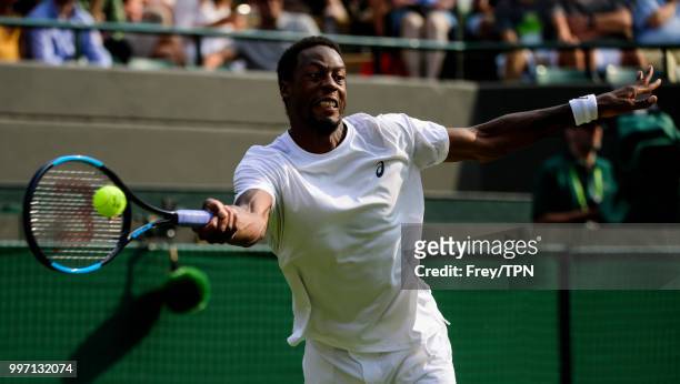Gael Monfils of France in action against Kevin Anderson of South Africa in the fourth round of the gentlemen's singles at the All England Lawn Tennis...