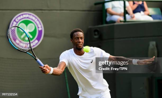 Gael Monfils of France in action against Kevin Anderson of South Africa in the fourth round of the gentlemen's singles at the All England Lawn Tennis...