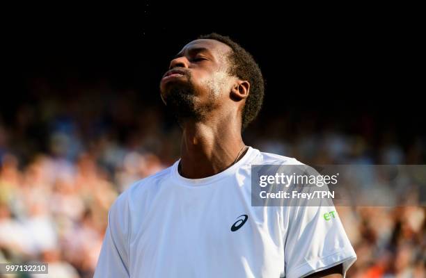 Gael Monfils of France looks frustrated against Kevin Anderson of South Africa in the fourth round of the gentlemen's singles at the All England Lawn...