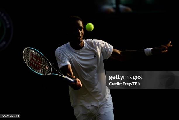 Gael Monfils of France in action against Kevin Anderson of South Africa in the fourth round of the gentlemen's singles at the All England Lawn Tennis...