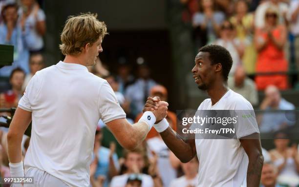 Kevin Anderson of South Africa shakes hands with Gael Monfils of France after beating him in the fourth round of the gentlemen's singles at the All...