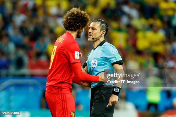 Marouane Fellaini of Belgium speaks with referee Milorad Mazic during the 2018 FIFA World Cup Russia Quarter Final match between Brazil and Belgium...