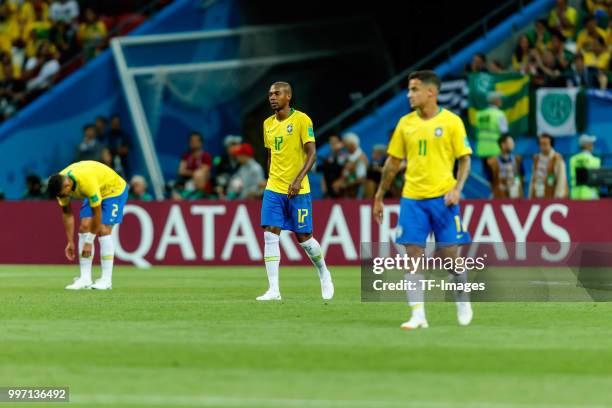 Thiago Silva of Brazil, Fernandinho of Brazil and Phlippe Coutinho of Brazil look dejected during the 2018 FIFA World Cup Russia Quarter Final match...