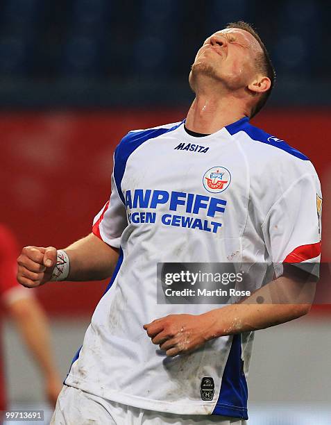 Enrico Kern of Rostock looks dejected during the Second Bundesliga play off leg two match between Hansa Rostock and FC Ingolstadt 04 at DKB Arena on...