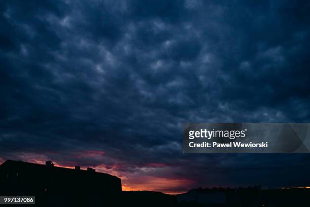 sunset over building - malopolskie province stock pictures, royalty-free photos & images