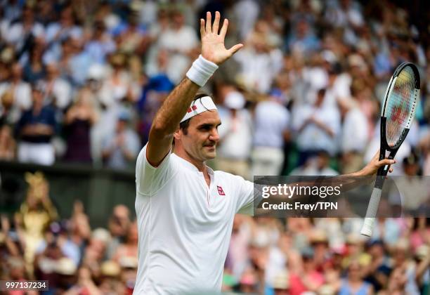 Roger Federer of Switzerland celebrates after beating Adrian Mannarino of France in the fourth round of the gentlemen's singles at the All England...