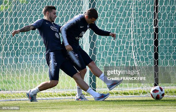 France's forward Antoine Griezmann vies with France's defender Lucas Hernandez during a training session at the Glebovets stadium in Istra, some 70...