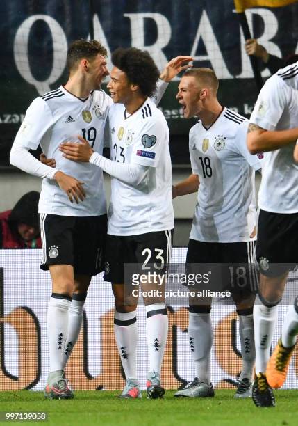 Germany's Leon Goretzka celebrating with Leroy Sane and Joshua Kimmich his scoring of the opener during the World Cup Group C soccer qualifier match...