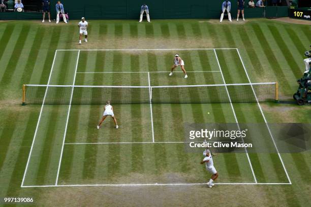 Juan Sebastian Cabal of Colombia and Abigail Spears of the United States in action against Jay Clarke and Harriet Dart of Great Britain return...