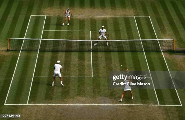 Juan Sebastian Cabal of Colombia and Abigail Spears of the United States in action against Jay Clarke and Harriet Dart of Great Britain return...