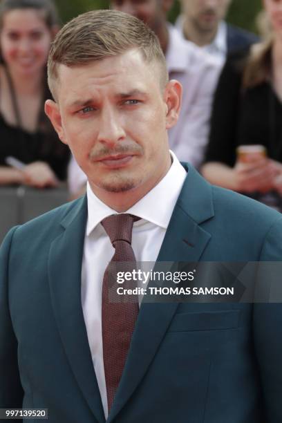 British actor Frederick Schmidt poses on the red carpet as he arrives to attend the world premiere of his new film Mission: Impossible Fallout, on...