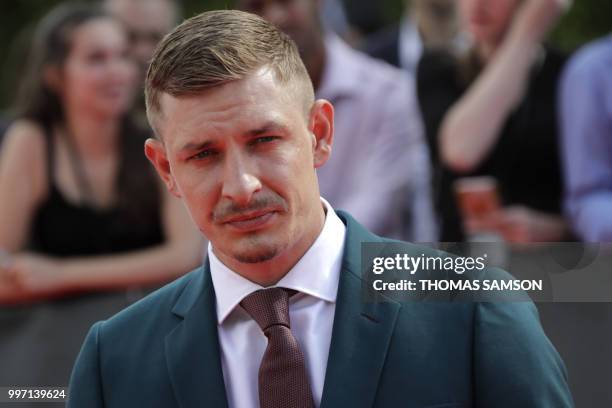 British actor Frederick Schmidt poses on the red carpet as he arrives to attend the world premiere of his new film Mission: Impossible Fallout, on...