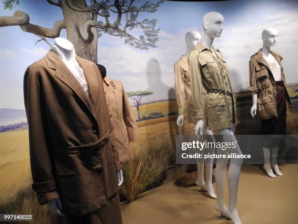 Safari-style fashion items by Abercrombie and Fitch, Burberry and Yves Saint Laurent, pictured at the exhibition "Expedition: Fashion from the...