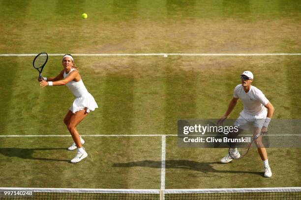 Jamie Murray of Great Britain and Victoria Azarenka of Belarus return against Jean-Julien Rojer and Demi Schuurs of The Netherlands during their...