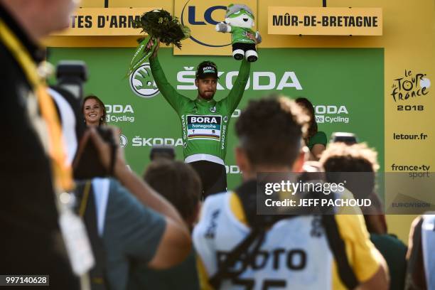 Slovakia's Peter Sagan, wearing the best sprinter's green jersey, celebrates on the podium after the sixth stage of the 105th edition of the Tour de...