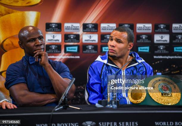 Retired boxer Chris Eubank sitting with his son Chris Eubank Jr. After the latter's fight at the Hanns-Martin-Schleyer-Halle in Stuttgart, Germany,...