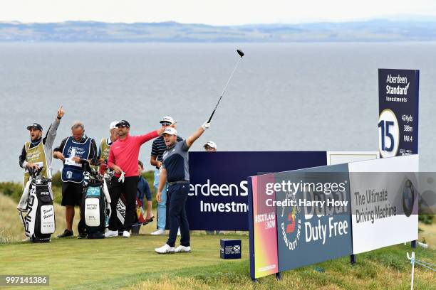 Tyrrell Hatton of England reacts to his tee shot on hole fifteen during day one of the Aberdeen Standard Investments Scottish Open at Gullane Golf...