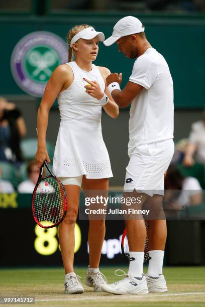 Jay Clarke and Harriet Dart of Great Britain discuss tactics during their Mixed Doubles quarter-final against Juan Sebastian Cabal of Colombia and...