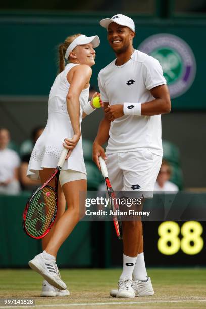 Jay Clarke and Harriet Dart of Great Britain laugh as they discuss tactics during their Mixed Doubles quarter-final against Juan Sebastian Cabal of...
