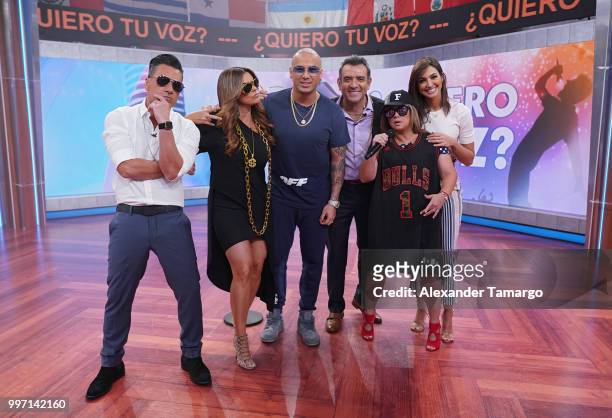 Jorge Bernal, Rashel Diaz, Wisin, Hector Sandarti, Adamari Lopez and Erika Csizer are seen on the set of "Un Nuevo Dia" at Telemundo Center to...