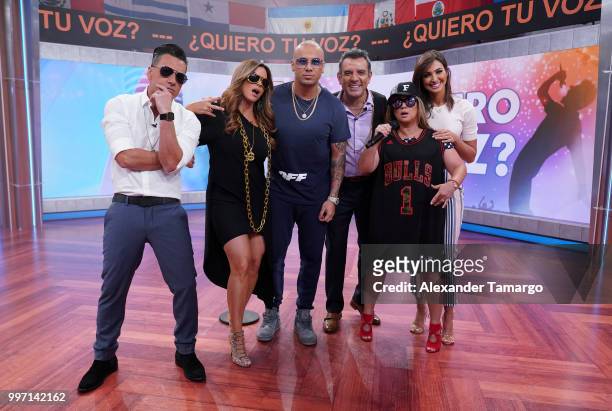 Jorge Bernal, Rashel Diaz, Wisin, Hector Sandarti, Adamari Lopez and Erika Csizer are seen on the set of "Un Nuevo Dia" at Telemundo Center to...