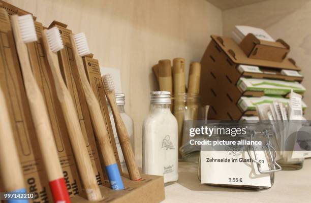 Toothbrushes, toothpaste and dental floss on a shelf at the Stueckgut packaging-free store in Hamburg, Germany, 5 September 2017. In Hamburg, more...