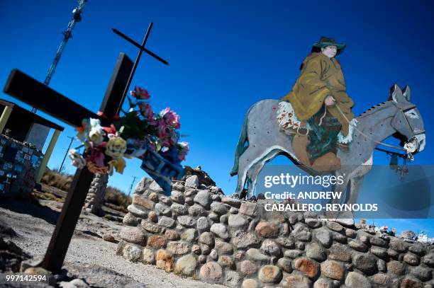 Monument to Priest and Gaucho, Jose Gabriel del Rosario Brochero, is seen on the side of the road on a mountain highway on the Pampa de Achala in...