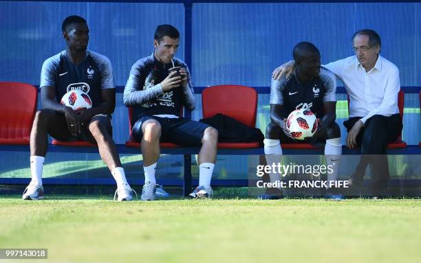 France's midfielder Paul Pogba, France's forward Antoine Griezmann, France's midfielder N'Golo Kante and French president of French football...