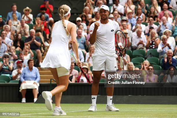 Jay Clarke and Harriet Dart of Great Britain celebrate a point against Juan Sebastian Cabal of Colombia and Abigail Spears of the United States...