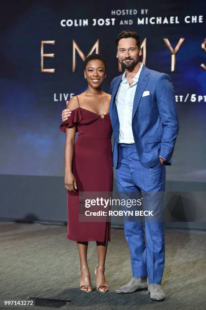 Actors Samira Wiley and Ryan Eggold pose on stage at the nominations announcement for the 70th Emmy Awards, July 12, 2018 at the Television Academy's...
