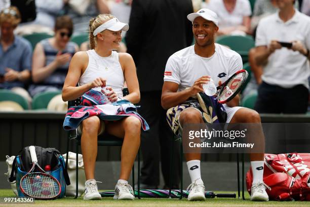 Jay Clarke and Harriet Dart of Great Britain laugh laugh during a break in their Mixed Doubles quarter-final match against Juan Sebastian Cabal of...