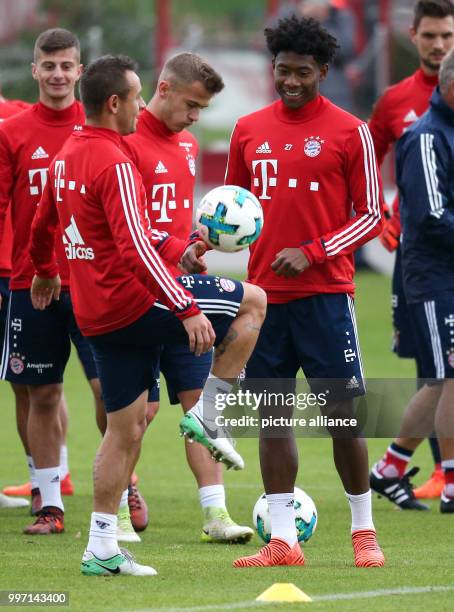 Rafinha and David Alaba take part in an FC Bayern Munich training session at Saebener Strasse in Munich, Germany, 9 October 2017. Photo: Amelie...