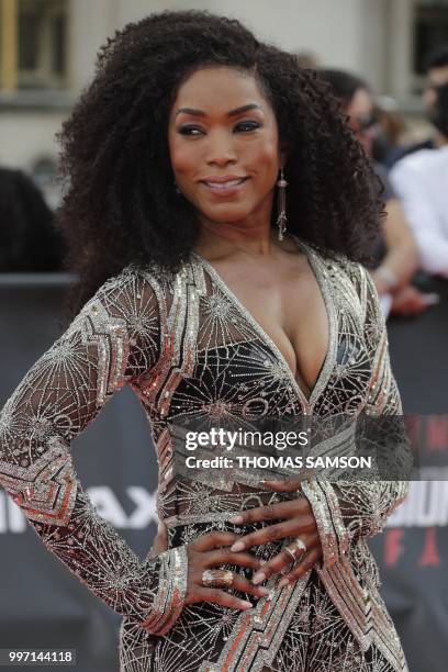 Actress Angela Bassett poses on the red carpet as she arrives to attend the world premiere of his new film Mission: Impossible Fallout, on July 12,...