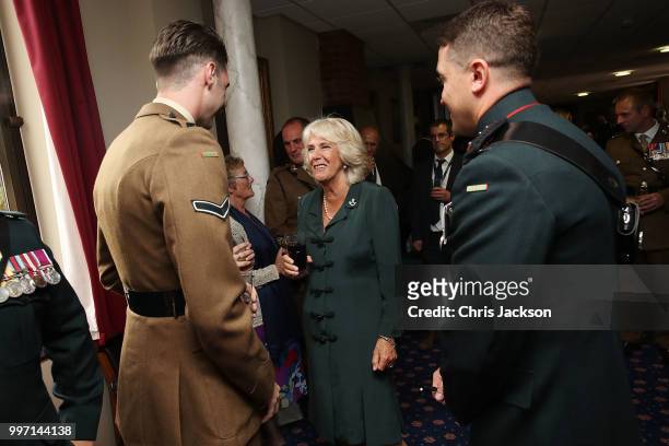 Camilla, Duchess of Cornwall speaks to soldiers during a visit to New Normandy Barracks on July 12, 2018 in Aldershot, England.