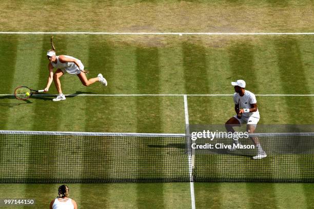 Jay Clarke and Harriet Dart of Great Britain return against Juan Sebastian Cabal of Colombia and Abigail Spears of the United States during their...