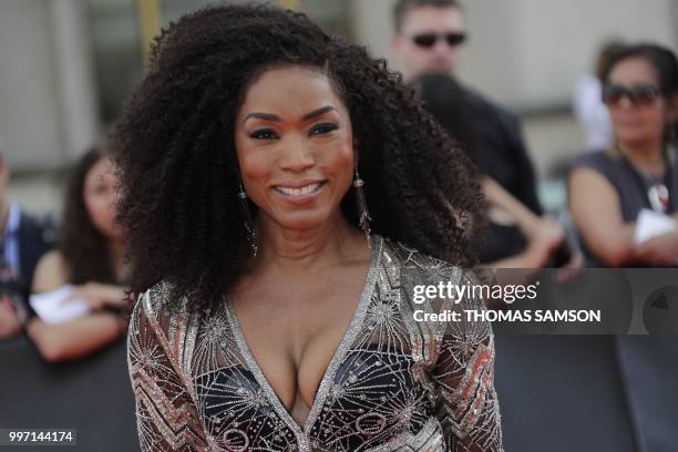 Actress Angela Bassett poses on the red carpet as she arrives to attend the world premiere of his new film Mission: Impossible Fallout, on July 12,...
