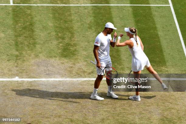 Jay Clarke and Harriet Dart of Great Britain discuss tactics during their Mixed Doubles quarter-final against Juan Sebastian Cabal of Colombia and...