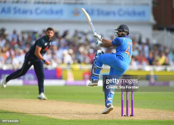 England bowler Liam Plunkett is pulled to the boundary by India batsman Rohit Sharma during the 1st Royal London One Day International match between...