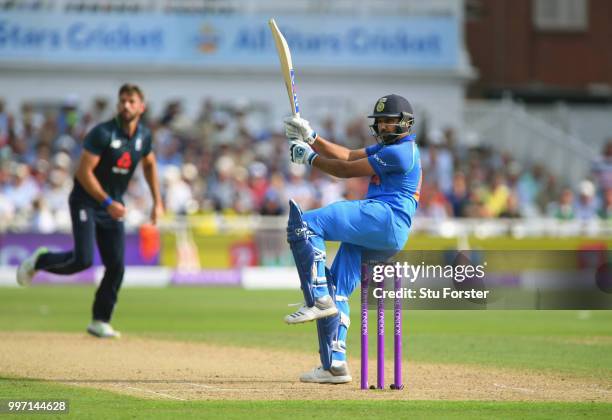 England bowler Liam Plunkett is pulled to the boundary by India batsman Rohit Sharma during the 1st Royal London One Day International match between...