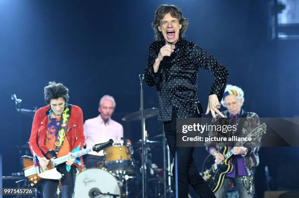 The Rolling Stones, composed of Ron Wood , Charlie Watts, Mick Jagger and Keith Richards performing onstage during a concert in the Esprit Arena in...