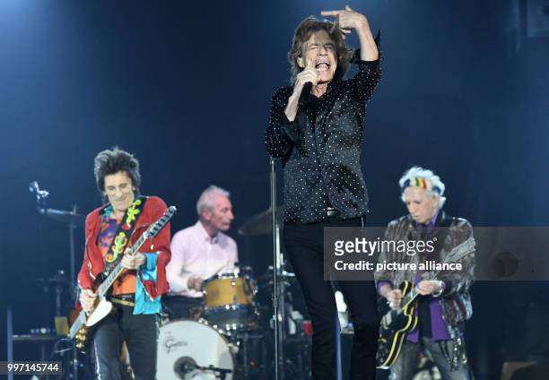 The Rolling Stones, composed of Ron Wood , Charlie Watts, Mick Jagger and Keith Richards performing onstage during a concert in the Esprit Arena in...