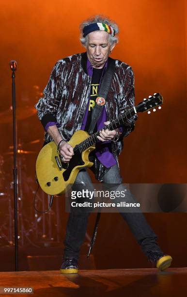 Keith Richards, guitar player for the band The Rolling Stones, performing onstage during a concert in the Esprit Arena in Dusseldorf, Germany, 09...