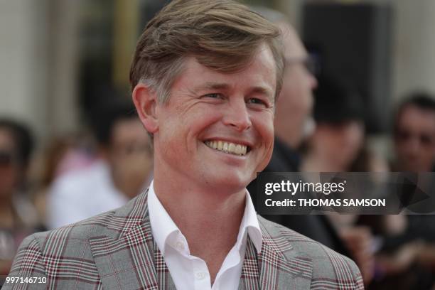 Danish actor Caspar Phillipson poses on the red carpet as he arrives to attend the world premiere of his new film Mission: Impossible Fallout, on...