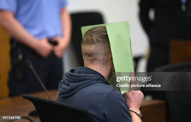 Year old man accused of the murder of a small child sitting in a hall of the District Court in Potsdam, Germany, 10 October 2017. According to the...