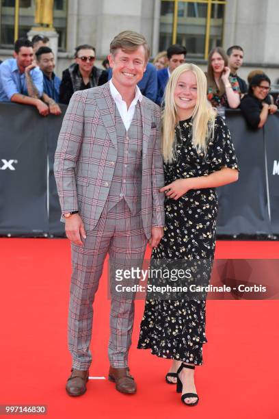 Actor Caspar Phillipson and guest attend the Mission: Impossible - Fallout' Global Premiere in Paris on July 12, 2018 in Paris, France.