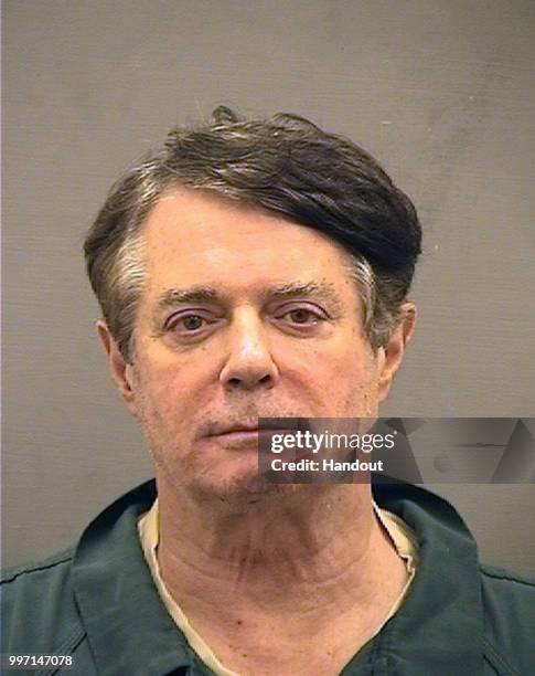 In this handout provided by Alexandria Sheriff's Office, Paul Manafort poses for a mugshot photo at the Alexandria Detention Center in Alexandria,...