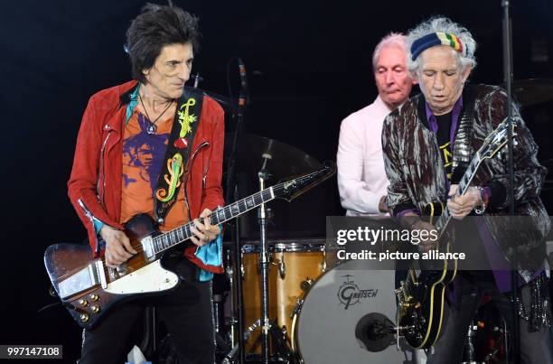 Guitarist Ron Wood drummer Charlie Watts and guitarist Keith Richards of English rock band The Rolling Stones perform on stage during a concert in...