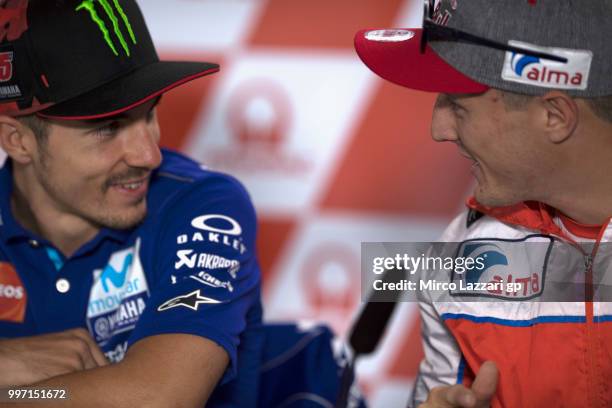 Maverick Vinales of Spain and Movistar Yamaha MotoGP speaks with Jack Miller of Australia and Alma Pramac Racing during the press conference...