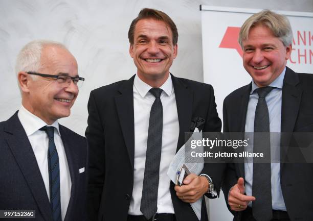 Heinrich Riethmoller , head of the German Publishers and Booksellers Association, Juergen Boos, the Fair's director, and Markus Dohle, Chairman of...