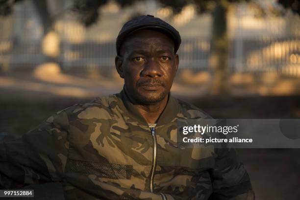 Uruanaani Scara Matundu, a representative of the Herero community, sitting in a park in Windhoek, Namibia, 12 May 2017. His family fled to Botswana...